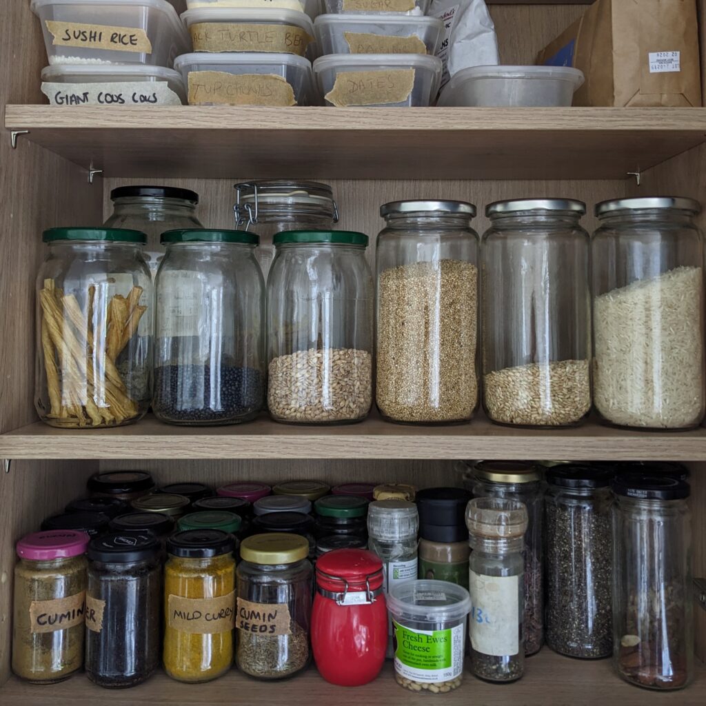 Waste-free refill pantry jars filled grains, pulses and spices