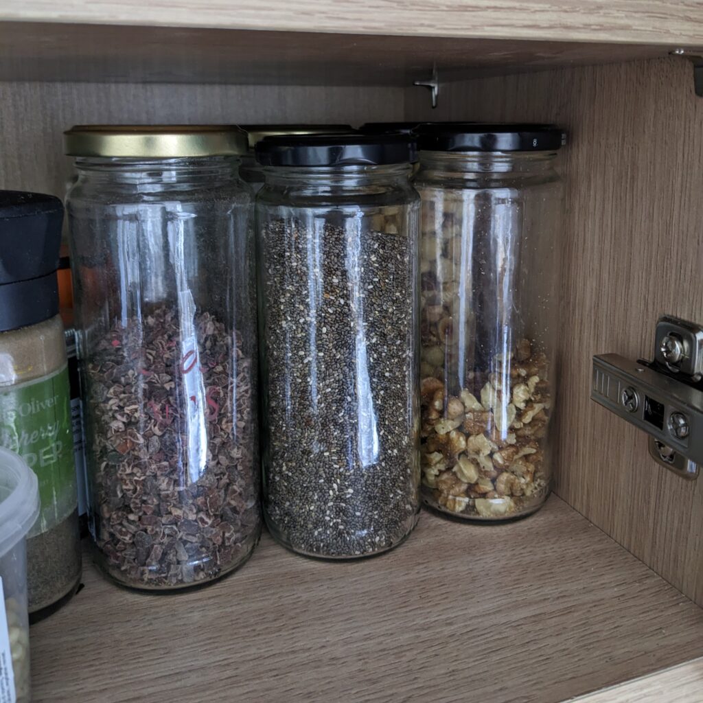 Waste-free refill pantry jars filled with nuts and seeds