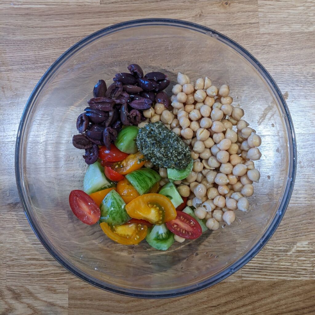 Orzo pasta salad ingredients in a bowl